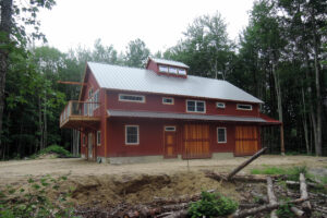 Geobarns, Maine Coast Barn, exterior red barn, home, porch, sliding doors