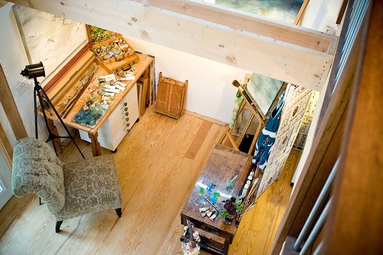 Interior picture of Robin Luciano Beatty's painting studio, design and built by Geobarns, showing the view from the mezzanine catwalk overlooking the artist's work station.er 