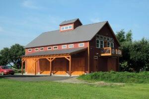 Geobarns, Lake Erie Auto Barn, exterior red barn, porch, barn doors, cupola