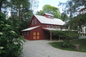 GeoBarns, Hudson Valley Auto Barn exterior landscape, porch roof, barn doors