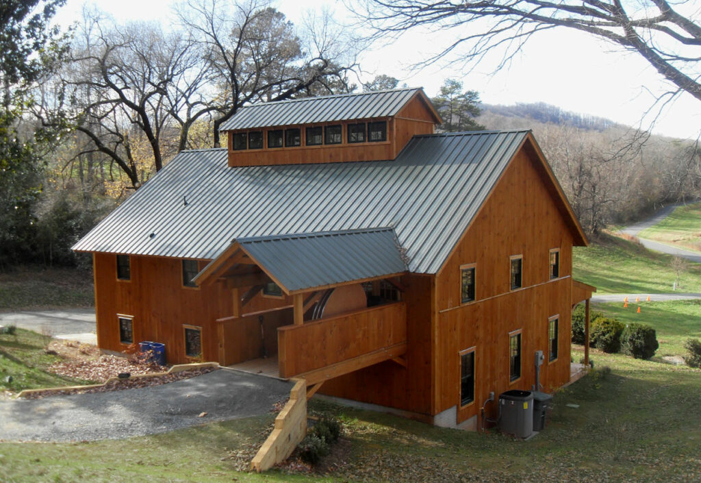A picture of the Baldwin Center at Bundoran Farm, designed and built by Geobarns, showing the entry bridge to the second floor.