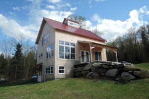 Geobarns, off-the-Grid home, exterior, stone wall, daylighting