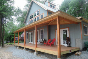 Geobarns, Lake House and Barn, exterior porch, french doors, timber framing