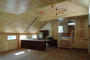 Geobarns, Lake Erie Auto Barn, interior loft kitchen, bedroom, timber frame, daylight