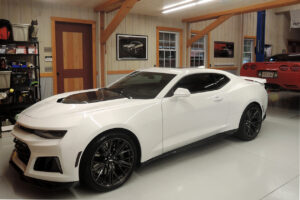 GeoBarns, Hudson Valley Auto Barn, interior shop, power lift, white Camaro