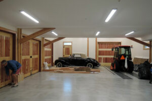 Geobarns, Lake Erie Auto Barn, interior workshop, timber clear span, antique car