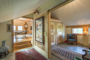 Geobarns, Historic Carriage House, interior sliding door, whitewashed ceiling
