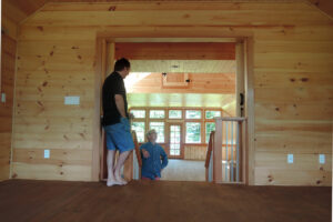 Geobarns, Lake Erie Auto Barn, interior view from loft, windows porch views