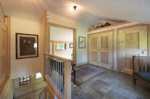 Geobarns, Historic Carriage House, interior mudroom, closets, barn doors, whitewashed ceiling, lighting