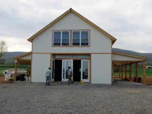 Geobarns, Holy Cross Anglican Church in Virginia, exterior entry, french doors, barn doors, covered porches