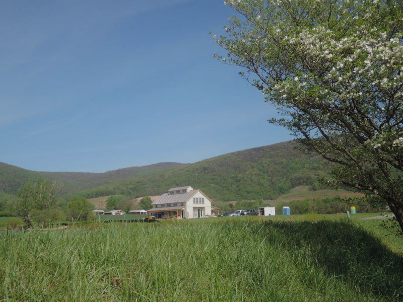 Geobarns, Holy Cross Anglican Church in Virginia, exterior farm landscape view, mountains