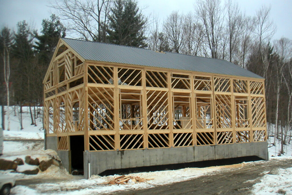 A picture of Robert Gasperetti's fine furniture workshop under construction. Design and built by Geobarns, the picture shows Geobarns's unique diagonal framing.