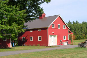 shop, exterior, red barn, woodworking, cupola, garage doors, porch, landscape