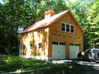 barn, metal roof, natural siding, windows, garage doors