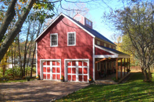 garage apartment, exterior, red barn, porch, timber, patio, barn doors