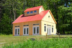 yoga barn, exterior landscape, red roof, french doors