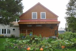 barn apartment, garage doors, home addition, porch, garden, cupola