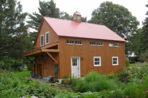 barn apartment, garage doors, porch, garden, cupola