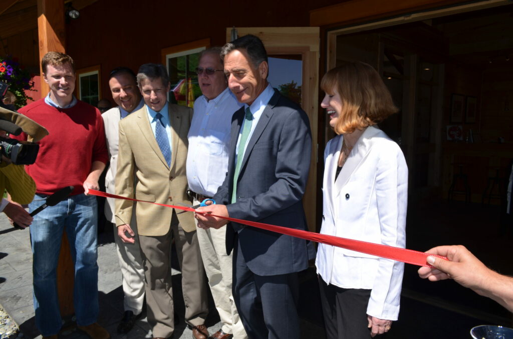A picture of the ribbon-cutting ceremony at The SILO Distillery in Windsor, Vermont, design and built by Geobarns.