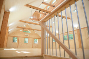 rustic stair railing metal wood daylight windows