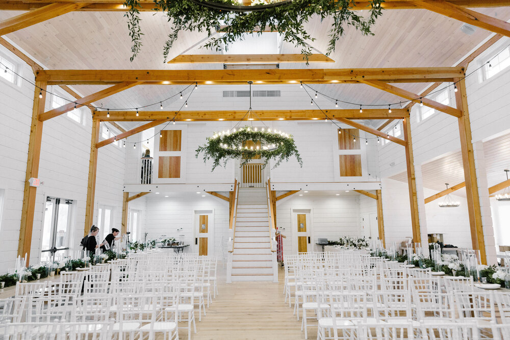 A picture of the Barn at Smuggler's Notch wedding hall being set up for a wedding