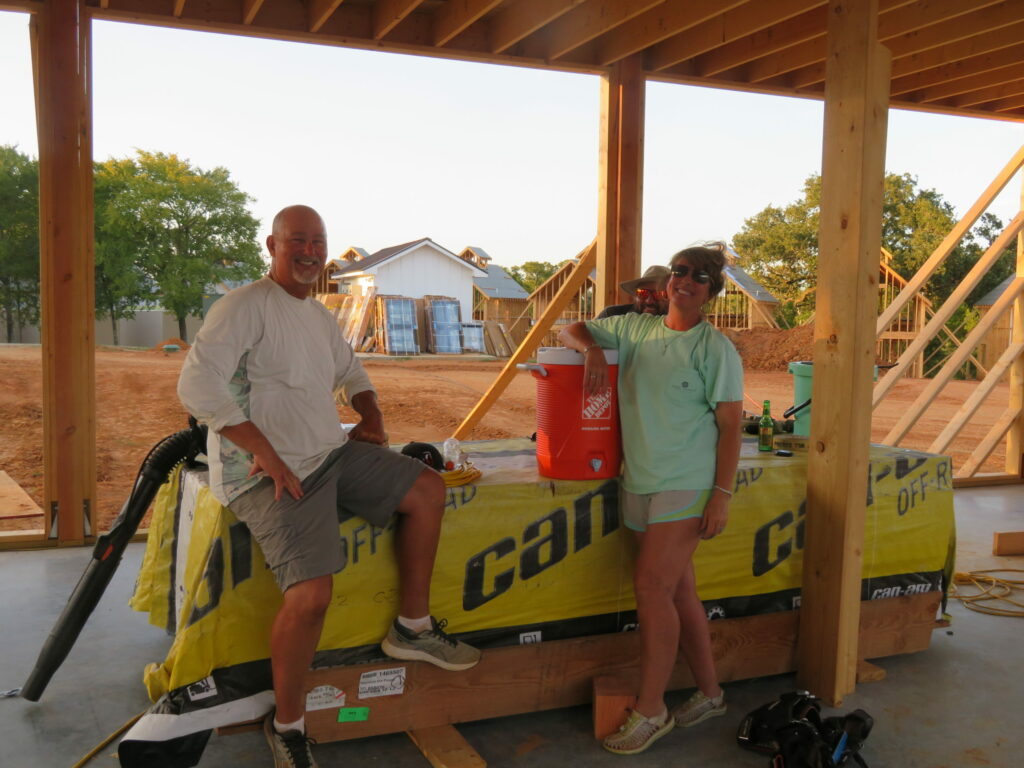 Arrowhead Hill under construction, design and built by Geobarns, showing the owners on site