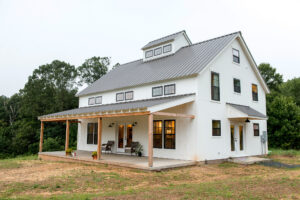 Geobarns, Shenandoah Modern Farmhouse Exterior with white siding, metal roof, and front porch