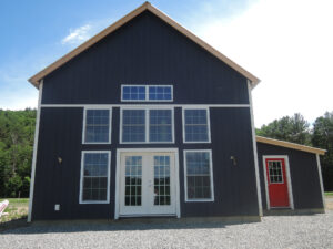 Geobarns, New Hampshire farmhouse exterior, landscape view of farmstead, french doors