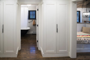 Geobarns; New England Modern Farmhouse; VT; Hallway Closet; White Panel Closet Doors;