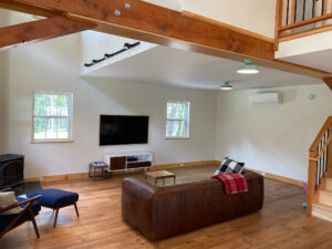 Geobarns; VT; Recreation Barn; Green Siding; Rolling Barn Doors; Cupola; Entertainment Room; Open Interior; Vaulted Ceiling; Home Office