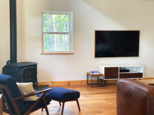 Geobarns; VT; Recreation Barn; Green Siding; Rolling Barn Doors; Cupola; Entertainment Room; Open Interior; Vaulted Ceiling; Home Office