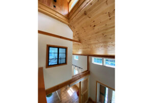 Geobarns; VT; Recreation Barn; Green Siding; Rolling Barn Doors; Cupola; Entertainment Room; Open Interior; Vaulted Ceiling; Home Office