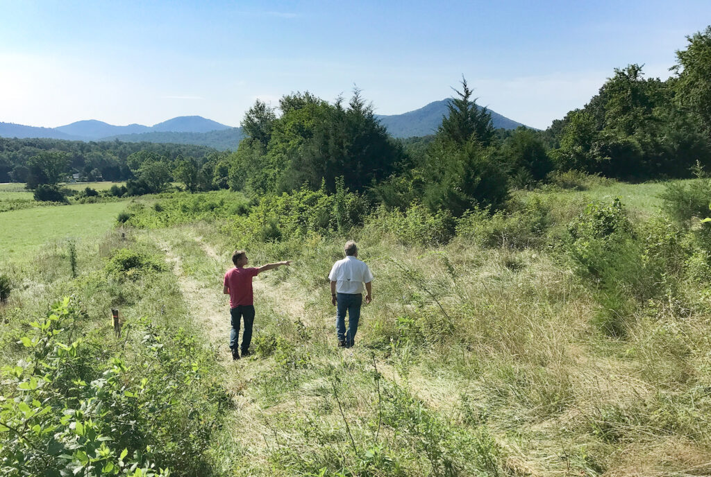 George Abetti of Geobarns explores a new building site with the client