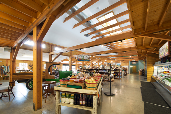 An interior picture of Waterfresh Market, showing exposed timbers, designed and built by Geobarns.