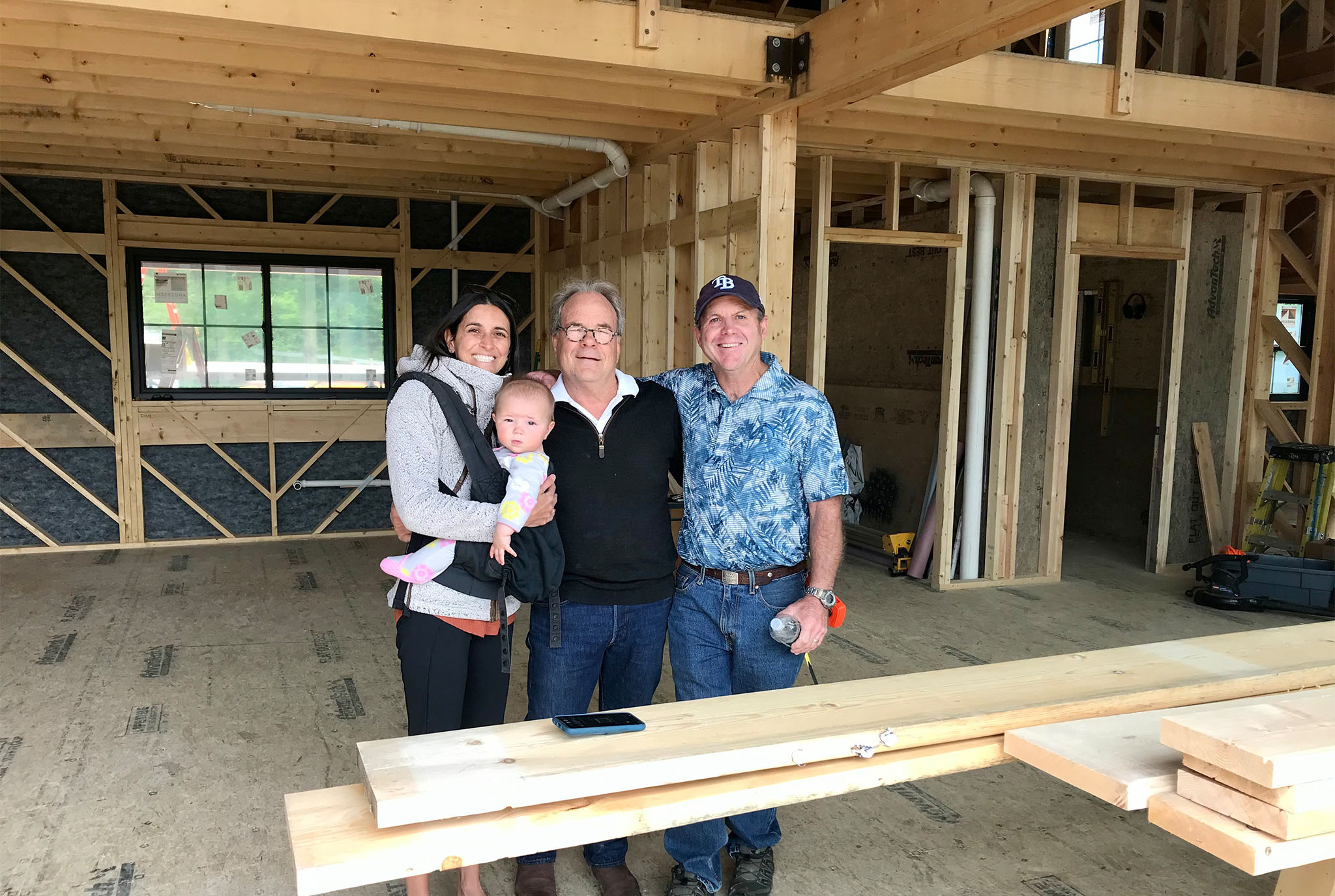 George Abetti of Geobarns meeting on site with clients to inspect construction progress.